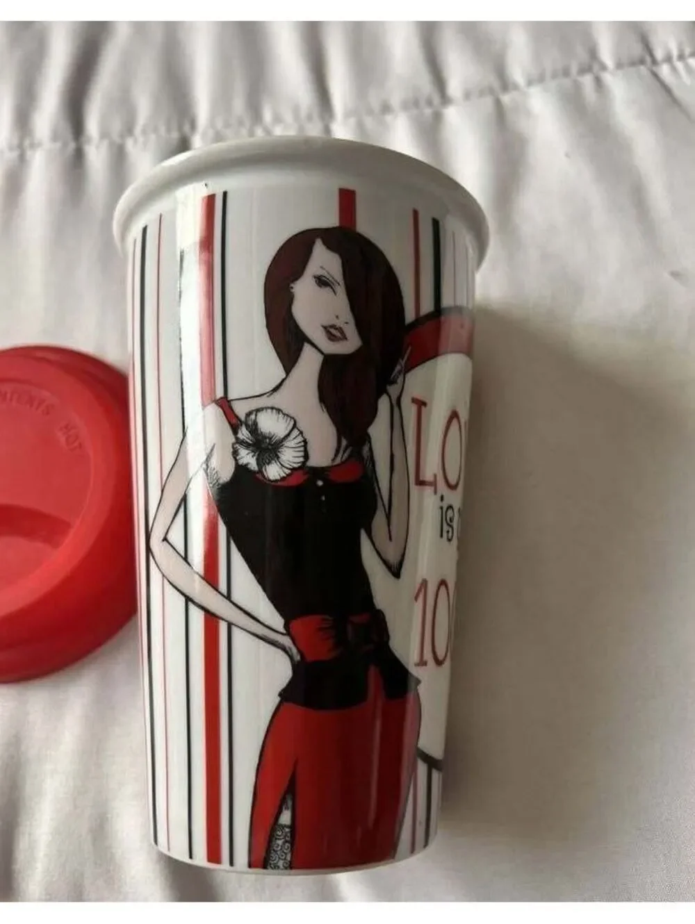 DRINKWARE Ceramic Travel Coffee Mug with Red Silicone Lid and Artistic Design